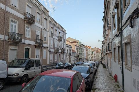 Residential street with tiled buildings in Lisbon, Portugal