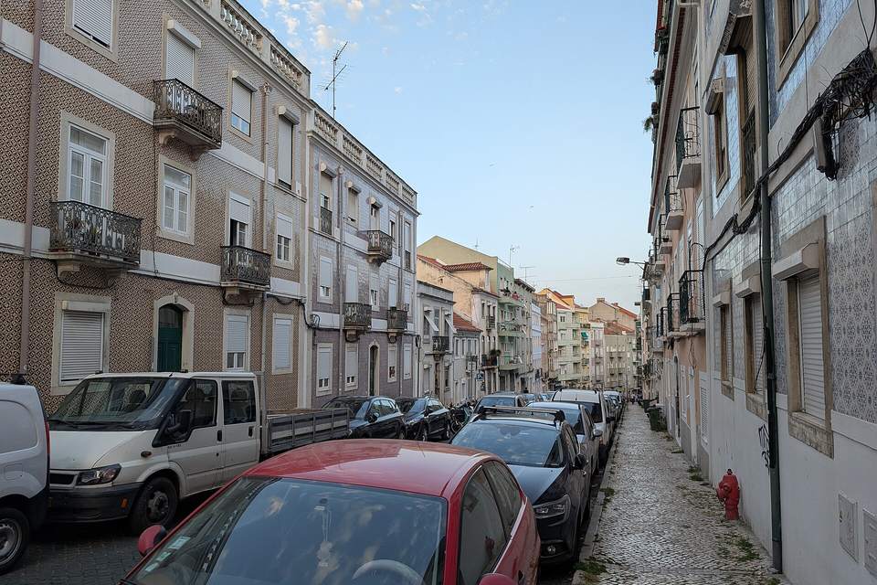 Residential street with tiled buildings in Lisbon, Portugal