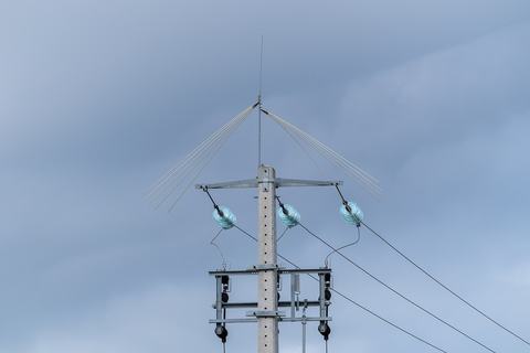 Concrete utility pole with power line insulators and bird protection, Ponte de sor, Portugal